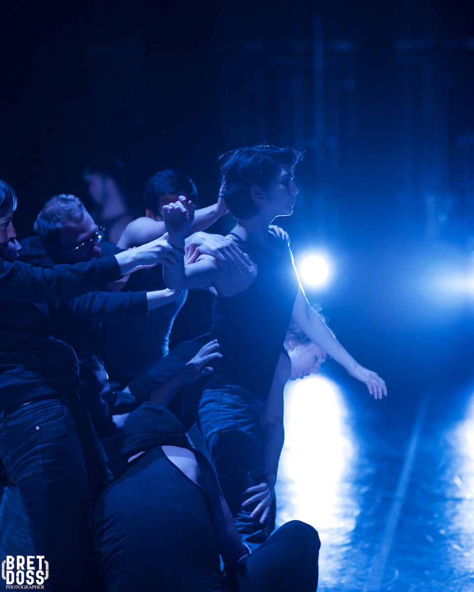 Ensemble in blue stage lighting